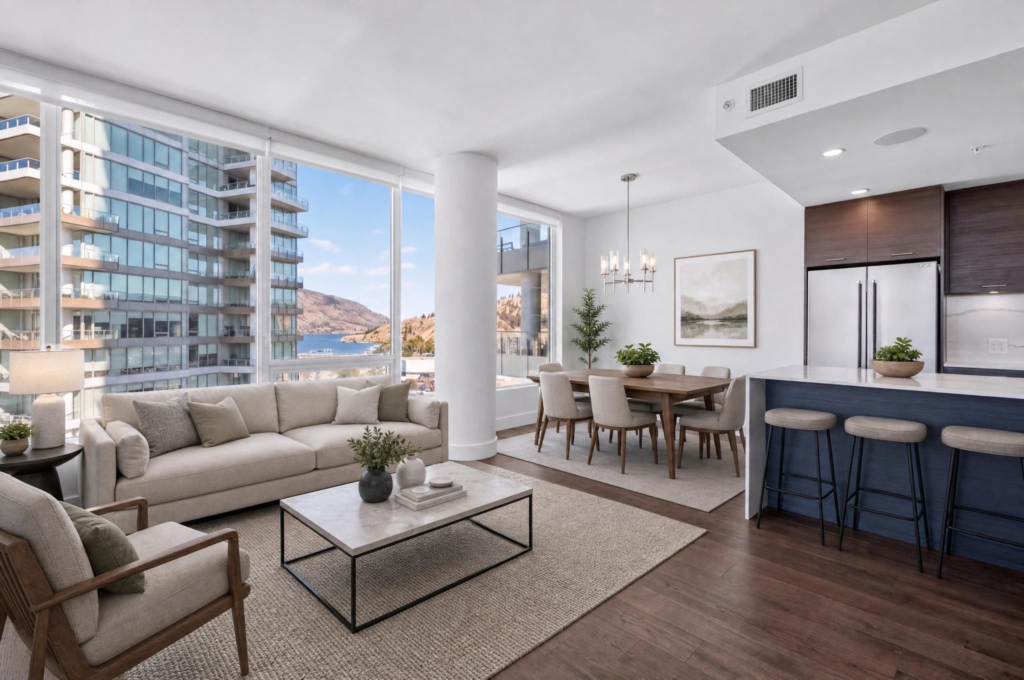 Open living and dining room staged in a modern style by Stage That Room