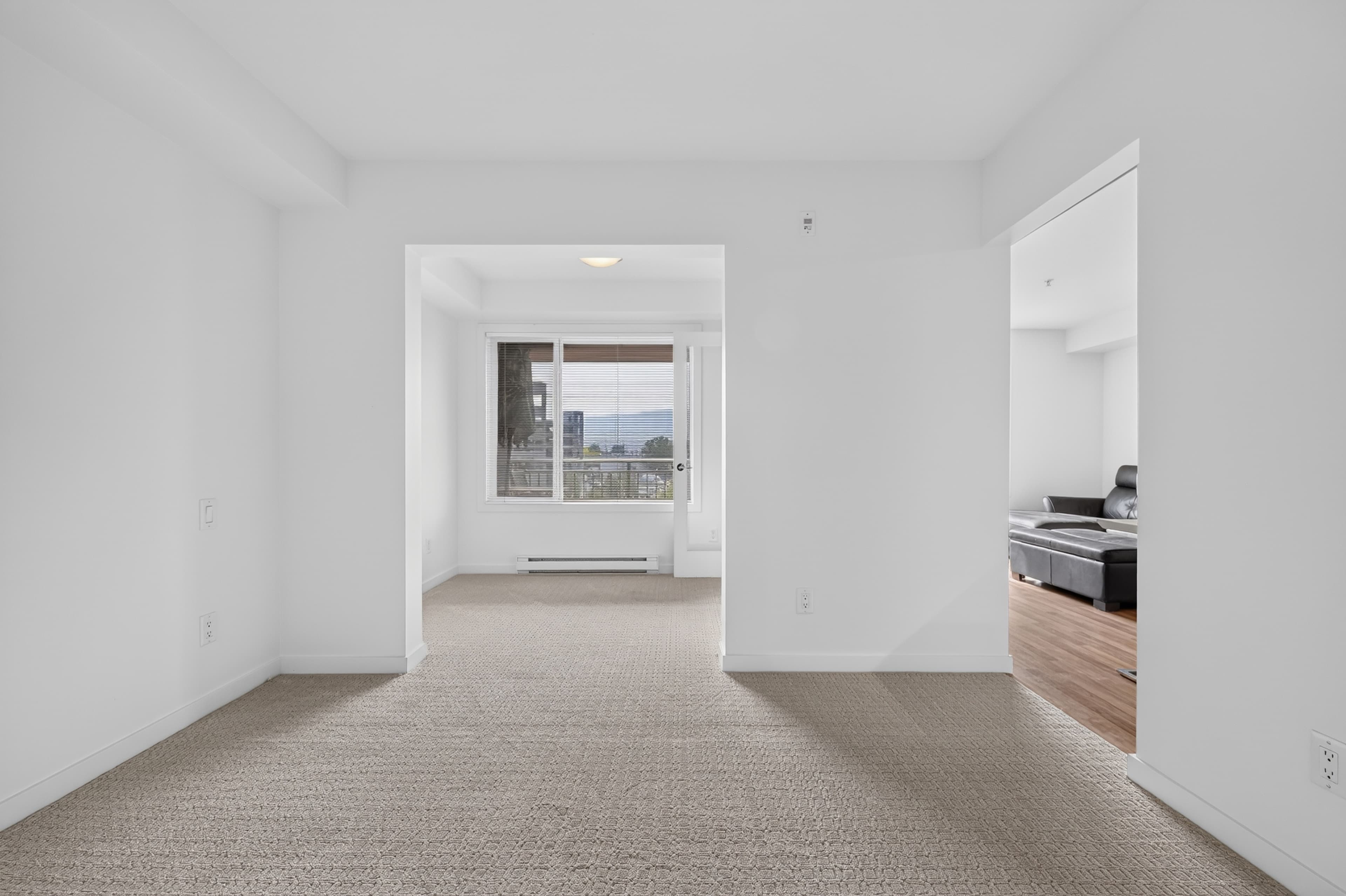 Second empty angle of the open-concept living and dining room