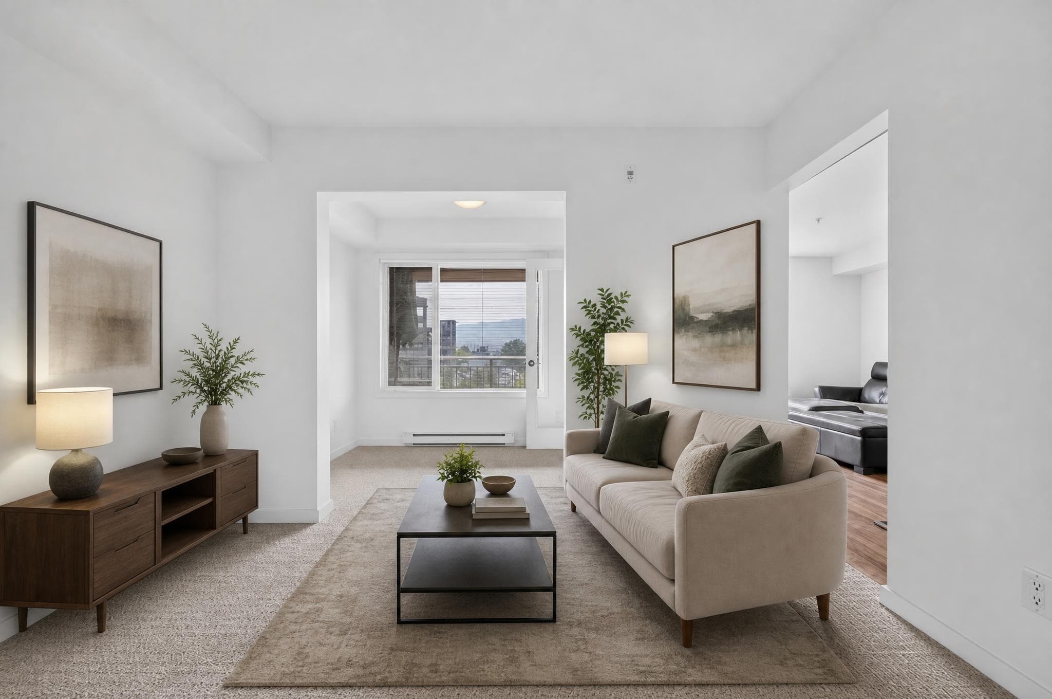 Second angle of the living and dining room furnished in a restrained modern style